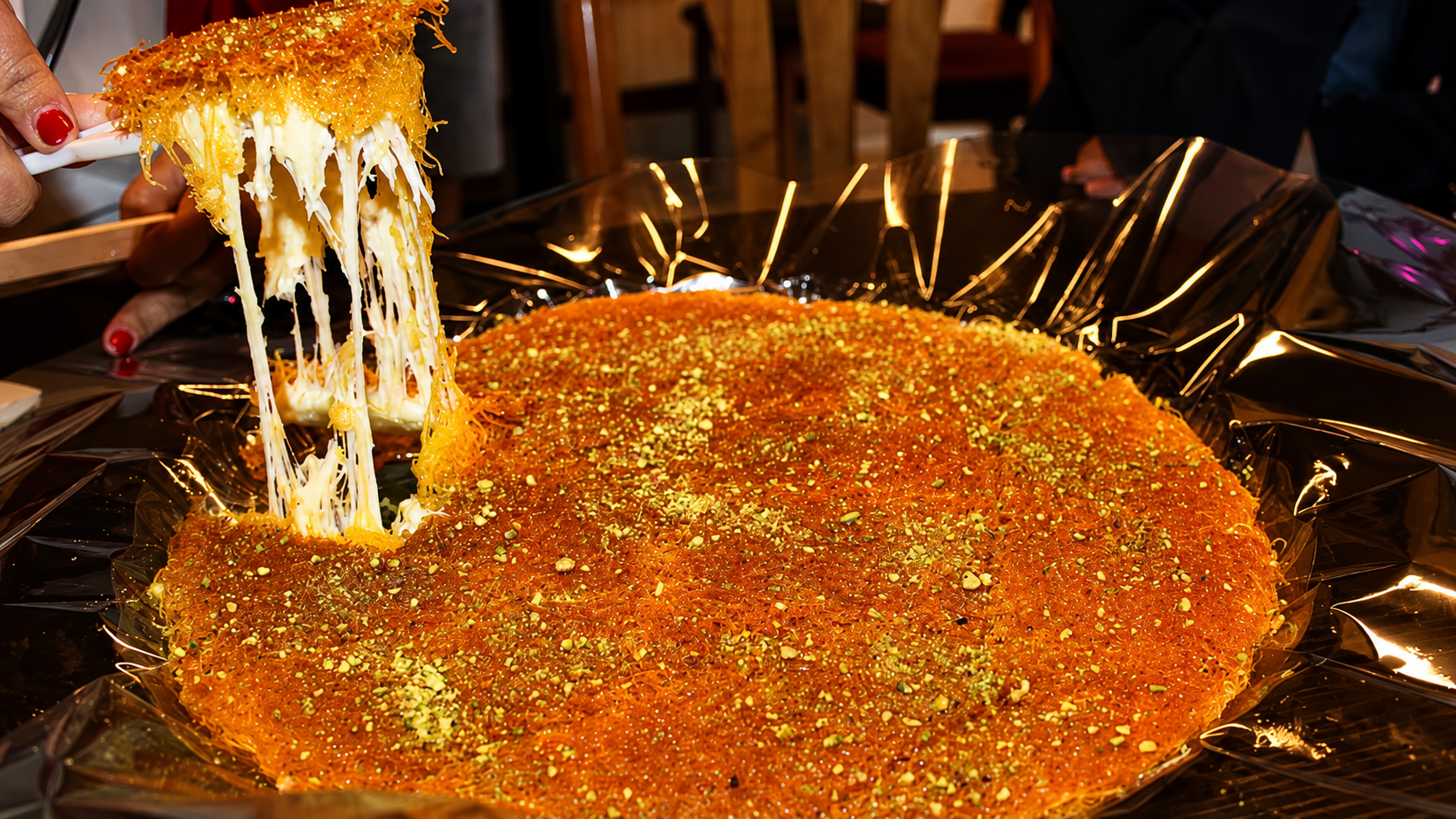 An intimate private home celebration with a knafeh tray
