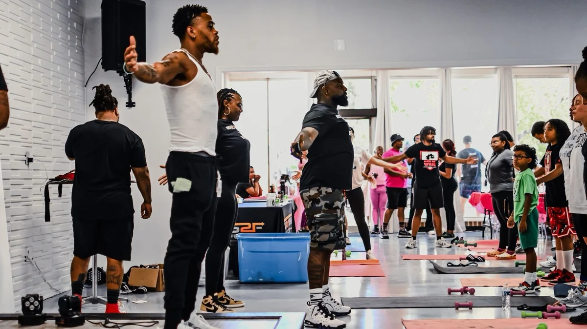 A District coach leading participants through a group workout