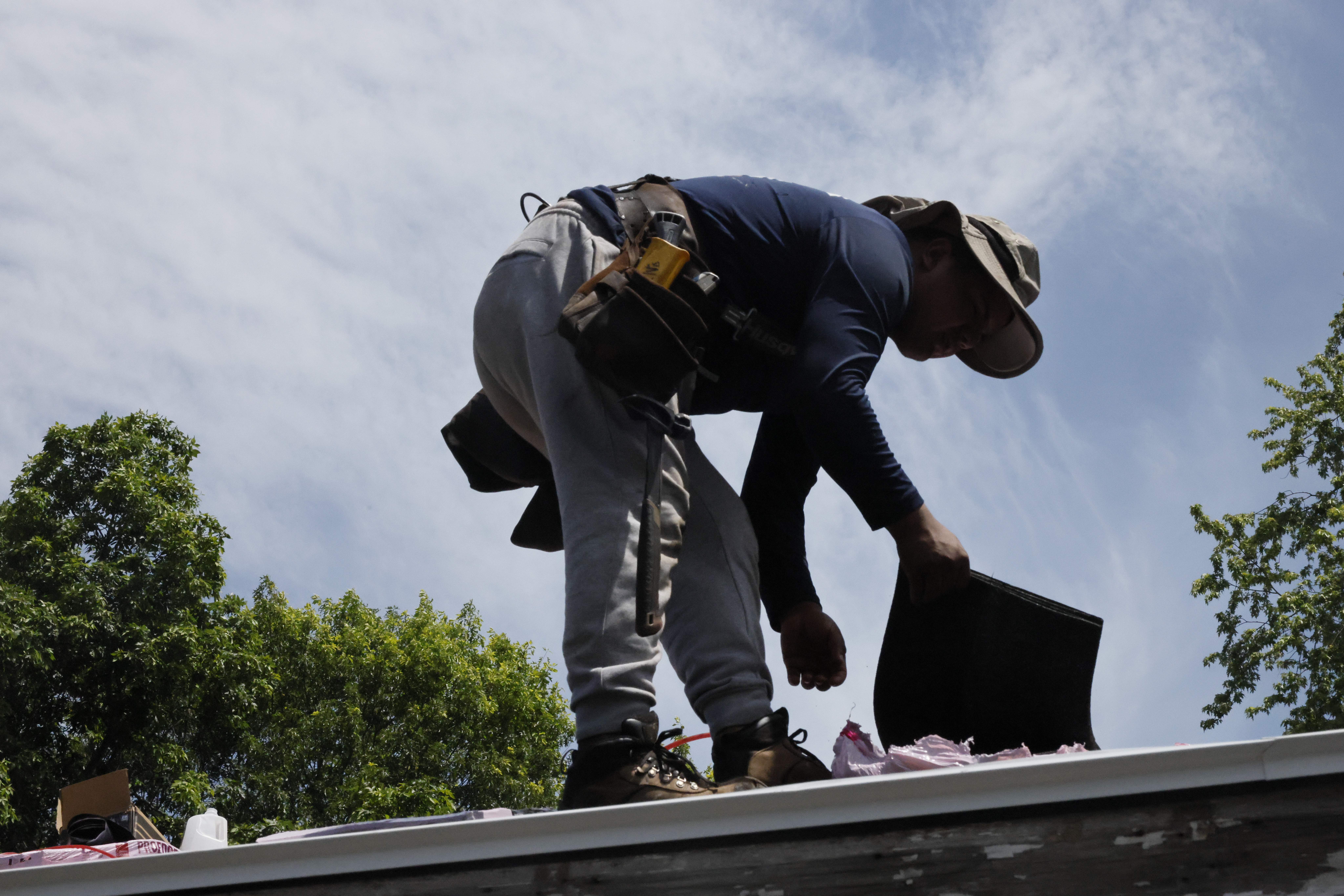 Gualan Brothers crew working on a home exterior