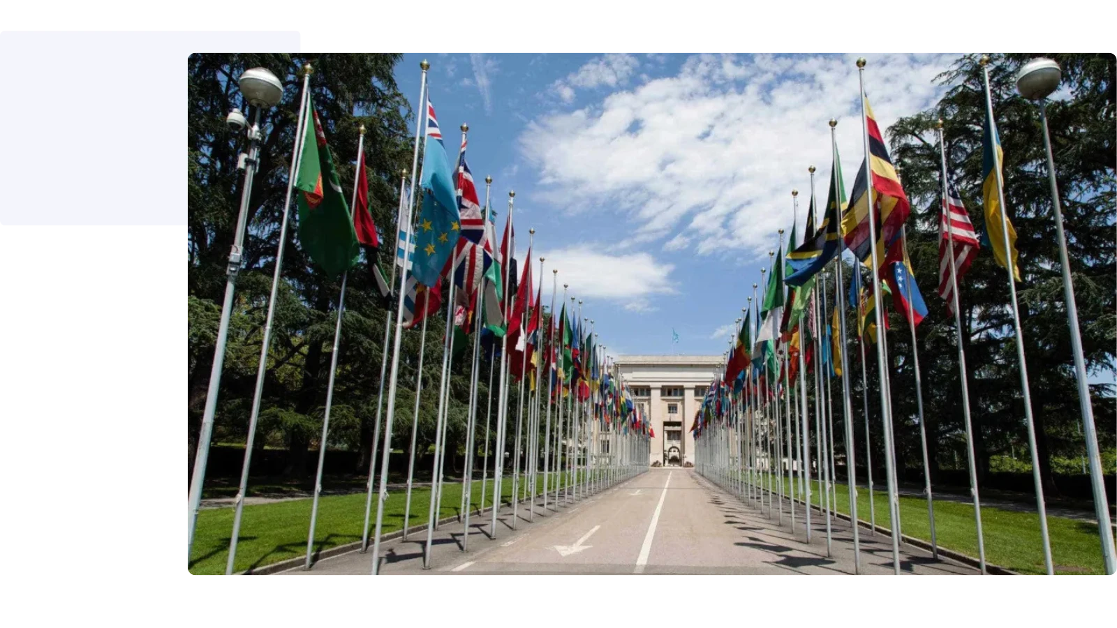 front of United Nations building with all the flags of the world