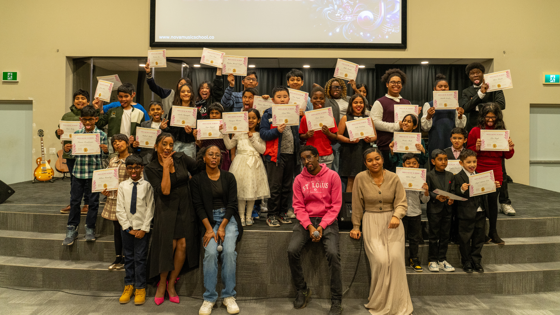A group of nova music students holding their certificates A group of nova music students holding their certificates