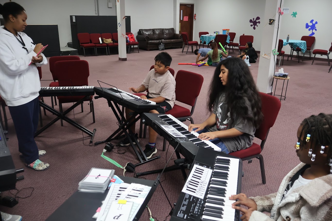 Young piano student practicing at a keyboard at Nova Music School Young piano student practicing at a keyboard at Nova Music School