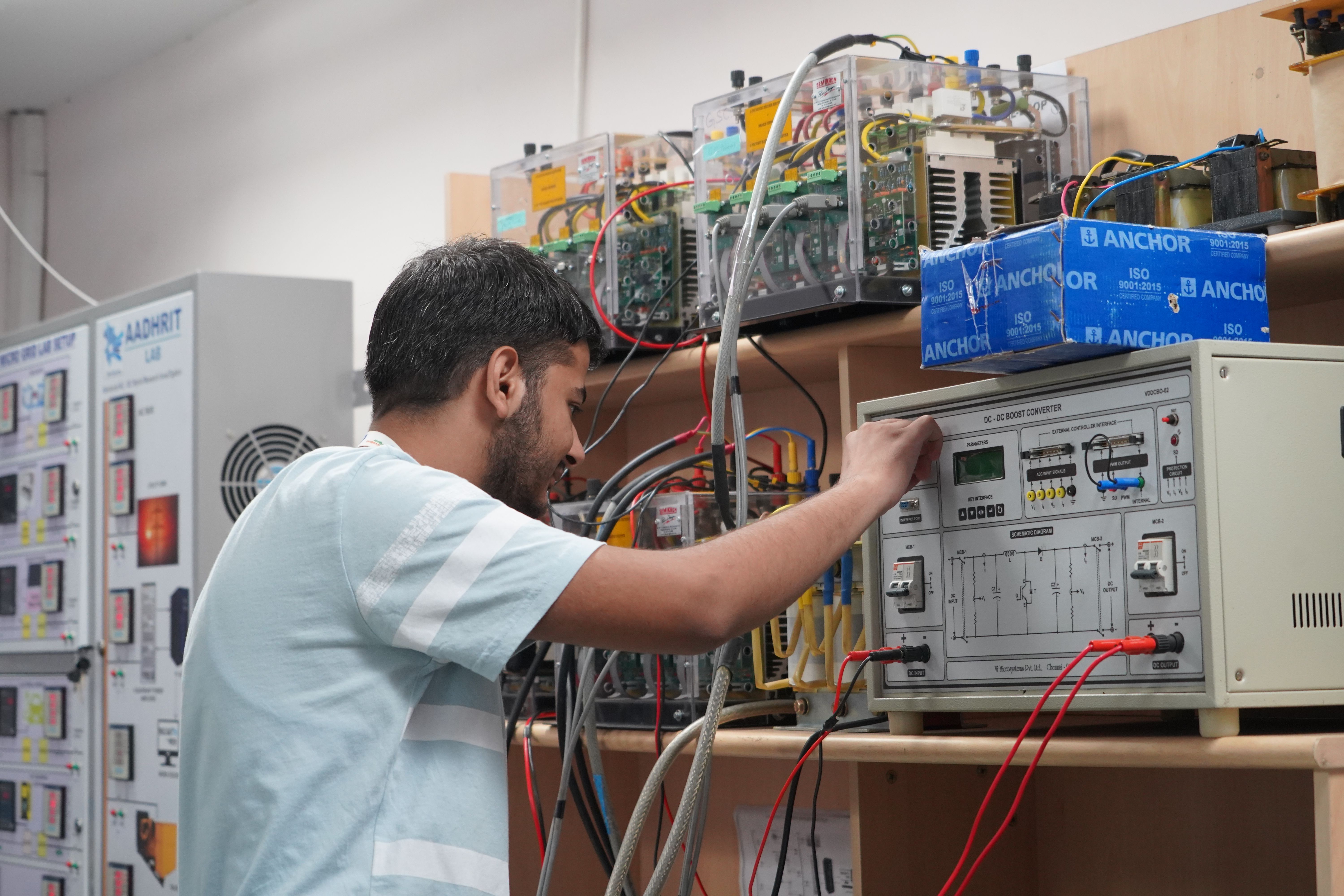 Engineer testing technical equipment in a research laboratory.