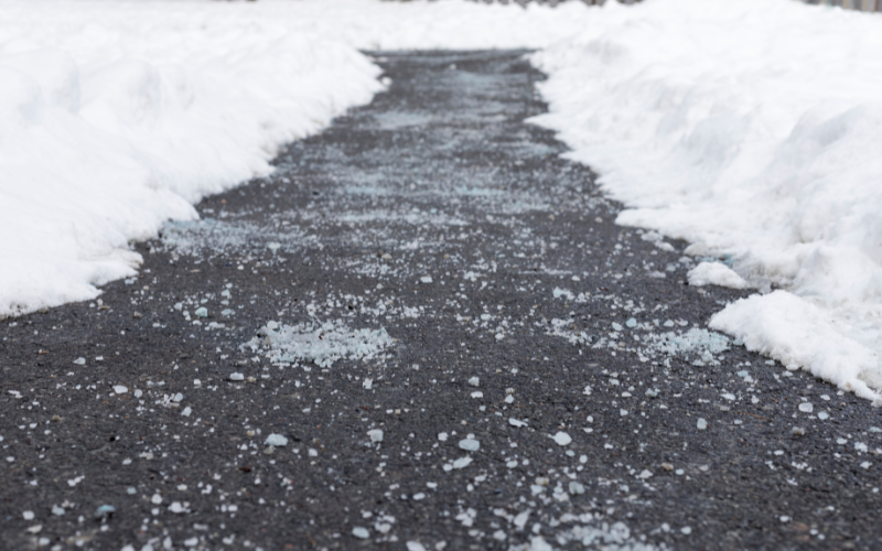 Snowy building entrance with salt residue