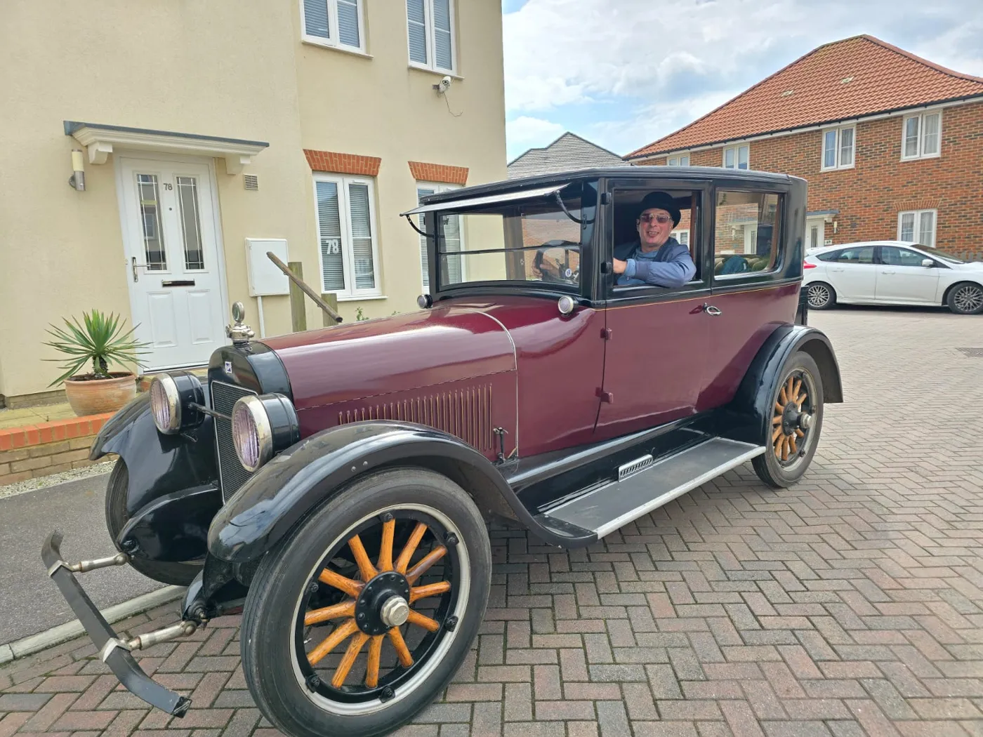 Aylesham mobile mechanic at the wheel of a restored vintage car in Kent