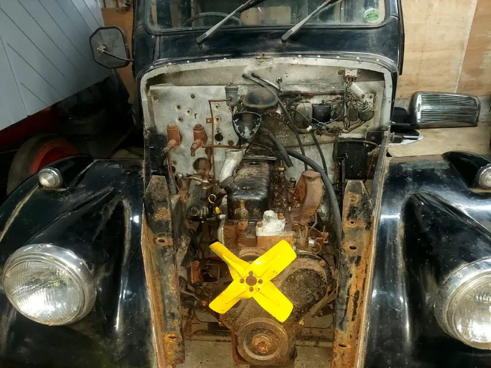Classic car engine bay stripped back during restoration