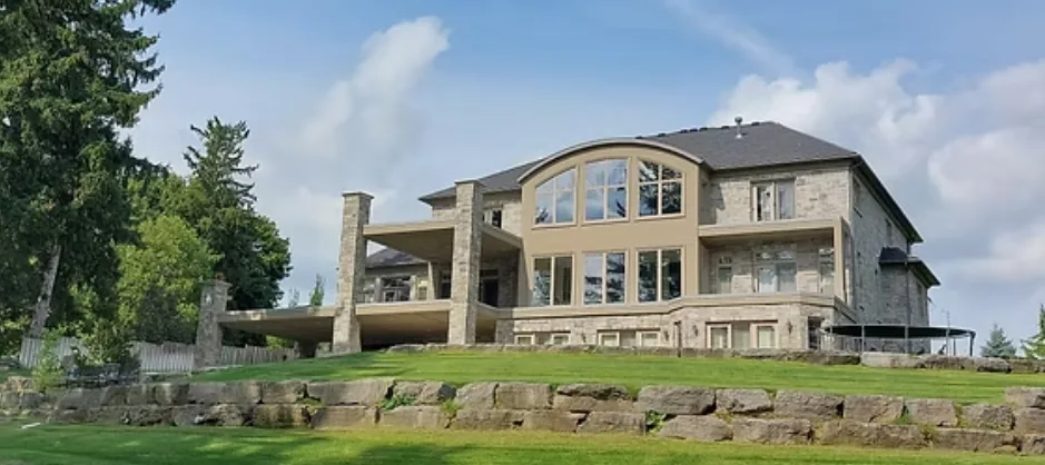 Large custom home exterior cladding — Norfolk County