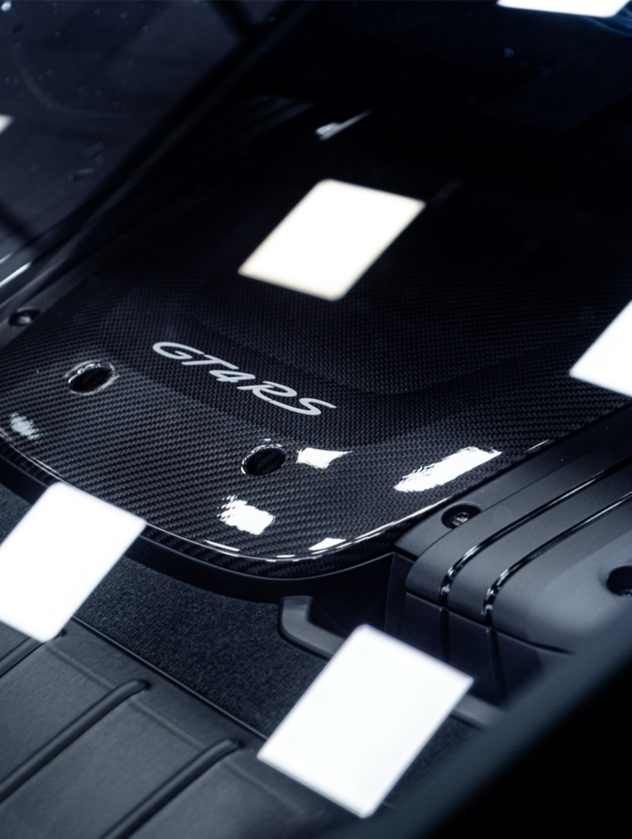 Close up of a carbon fibre panel marked GT4 RS