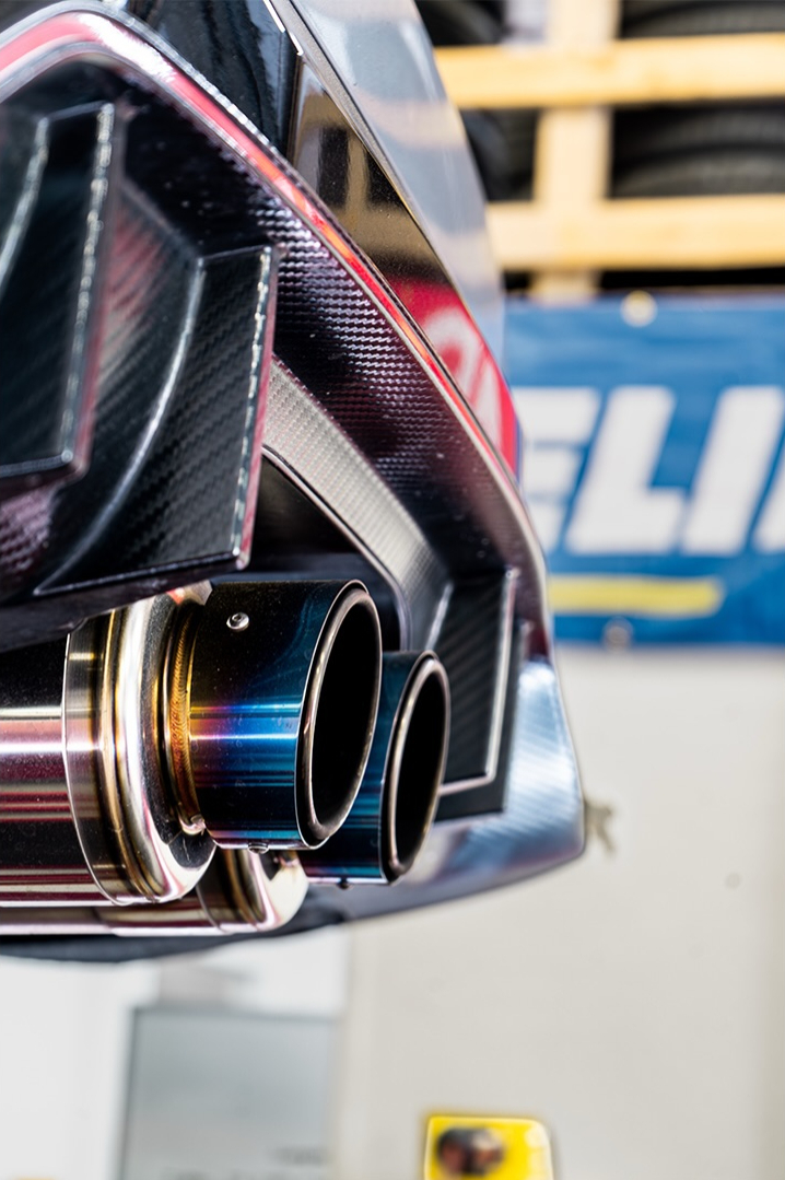 Close up of a titanium exhaust tip and rear diffuser