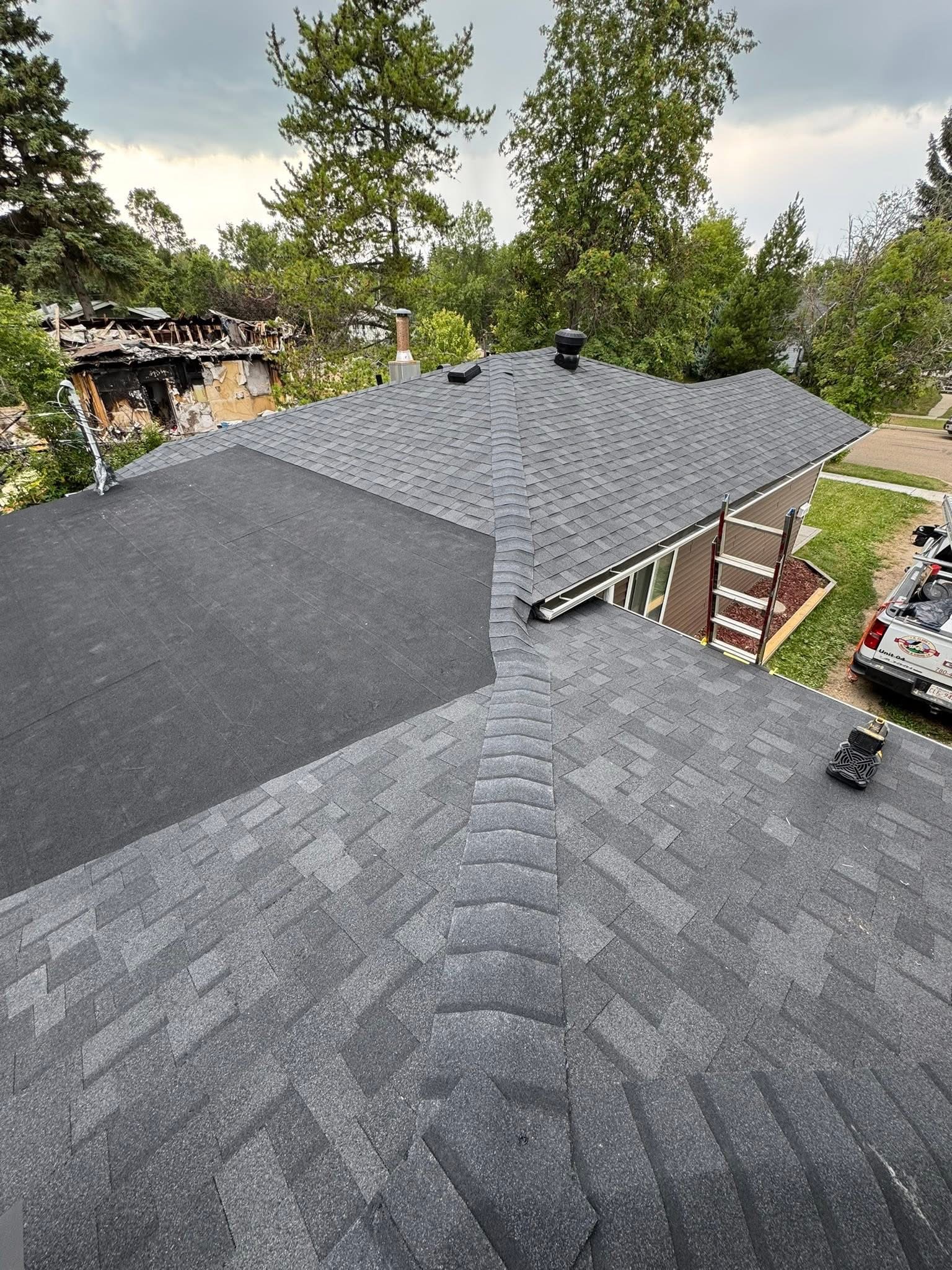 Residential roof with gray shingles in an Edmonton-area neighborhood
