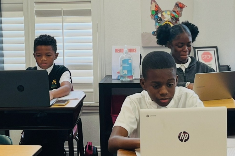 children on laptops tech