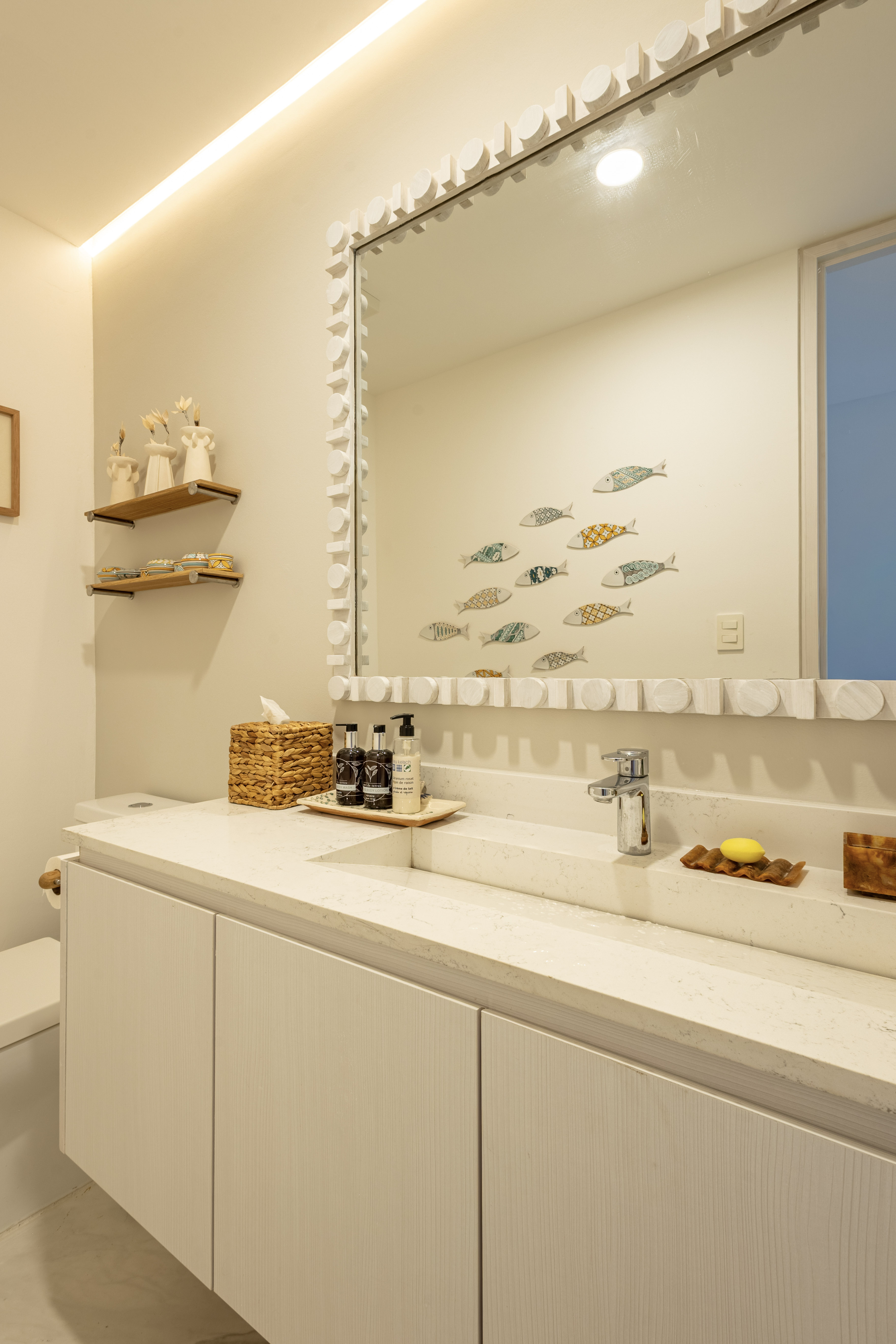 Bathroom vanity with fish artwork
