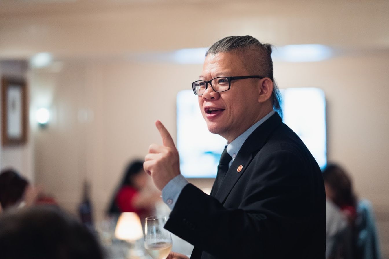 Chris Low explaining a wine to guests