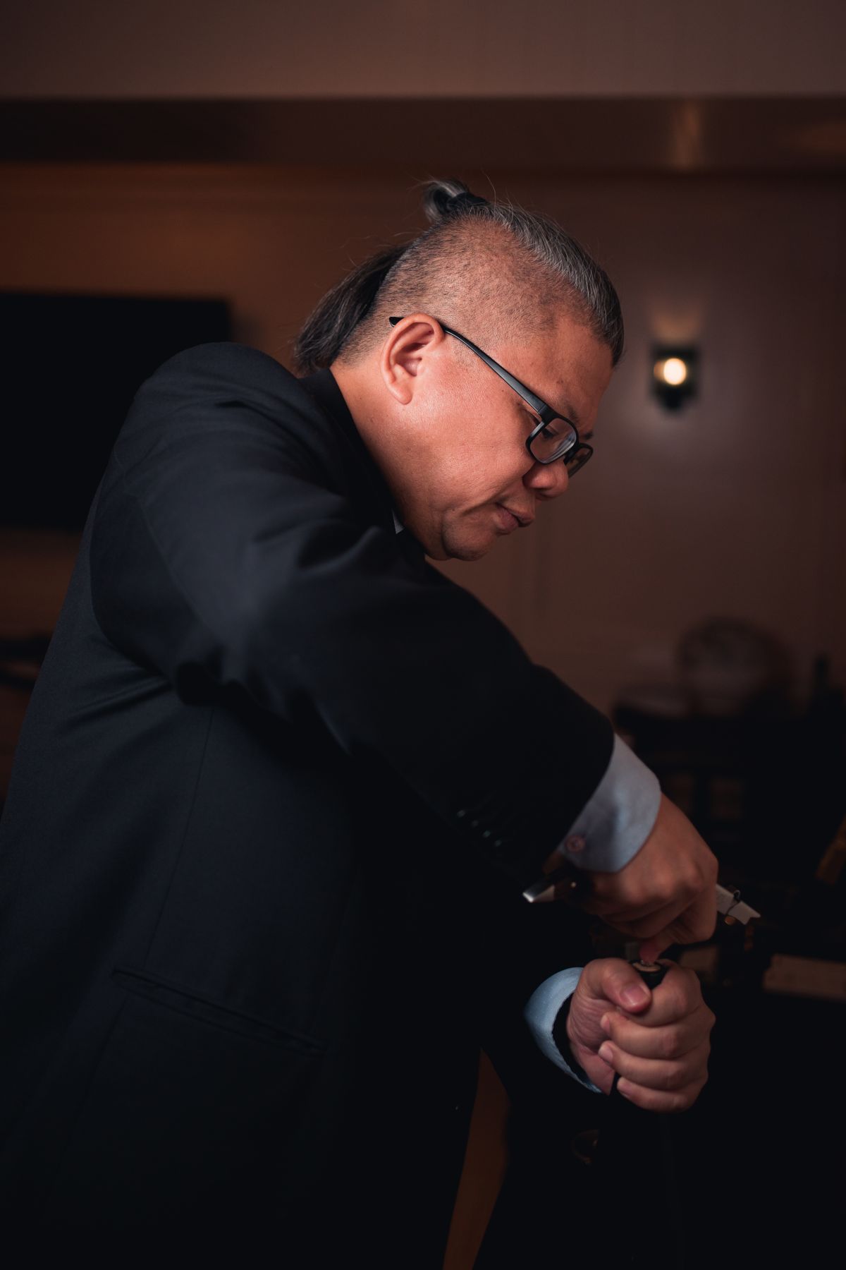 Chris Low opening a bottle at a private tasting