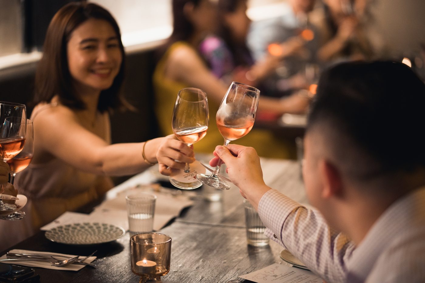 Guests toasting with rosé