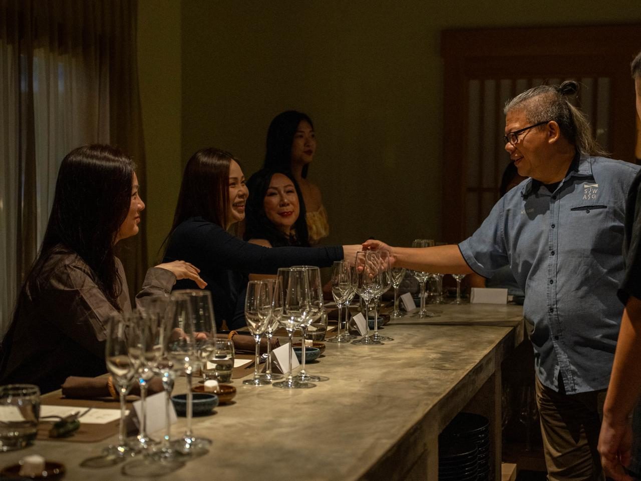 Chris Low greeting guests at a tasting
