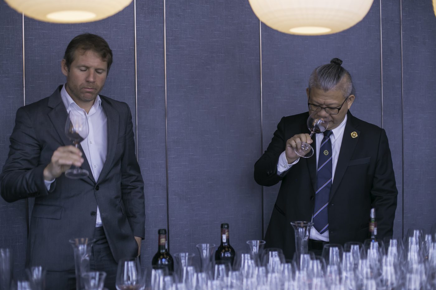 Chris Low nosing wine with a winemaker
