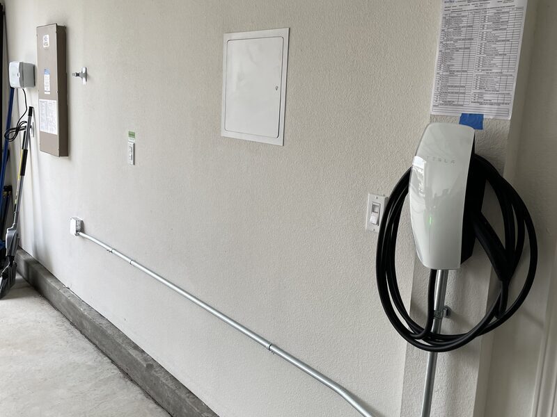 Tesla Wall Connector mounted with a clean conduit run
