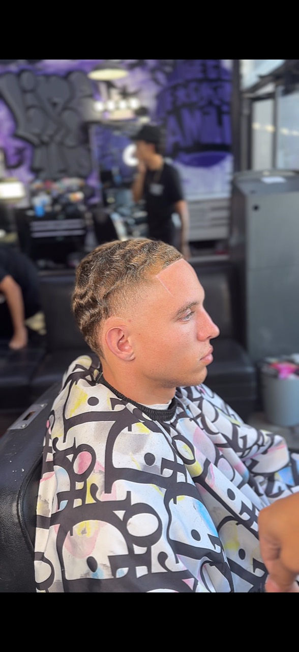 Side profile of a client with defined waves, a close gradient, and a sharp front hairline.