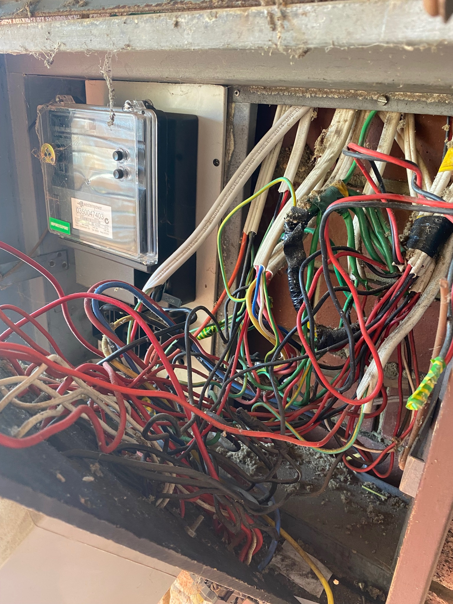 Messy overloaded switchboard, Perth home