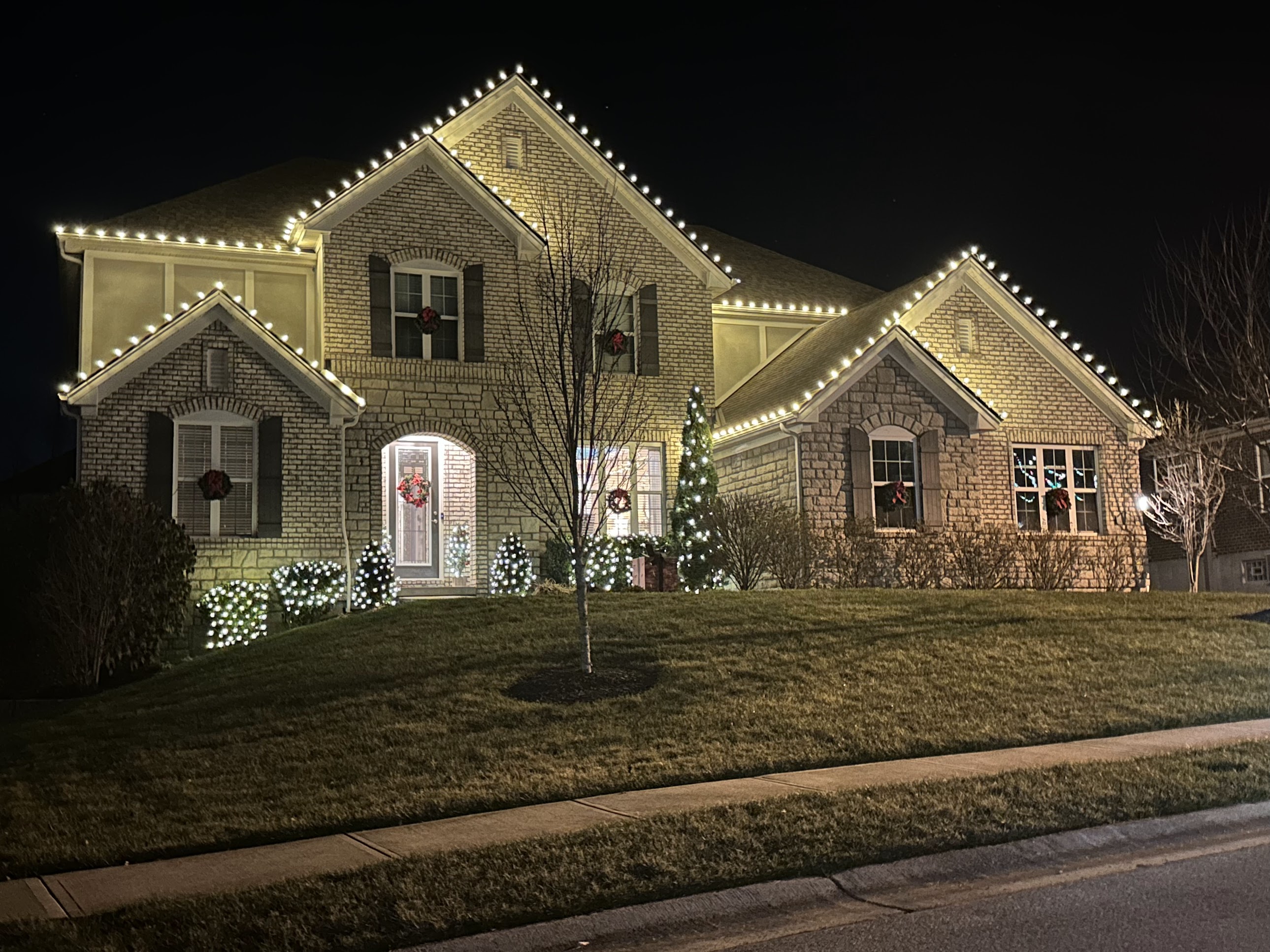 LED C9 Christmas lights on an Olympia home roofline at dusk LED C9 Christmas lights on an Olympia home roofline at dusk
