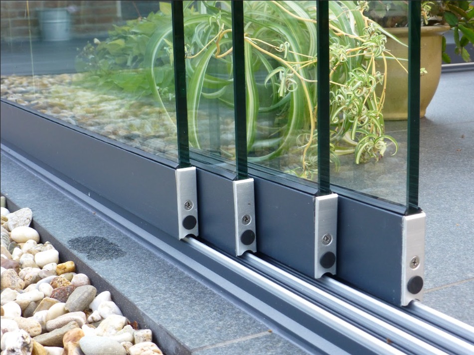 Modern glass veranda creating a sheltered outdoor living space