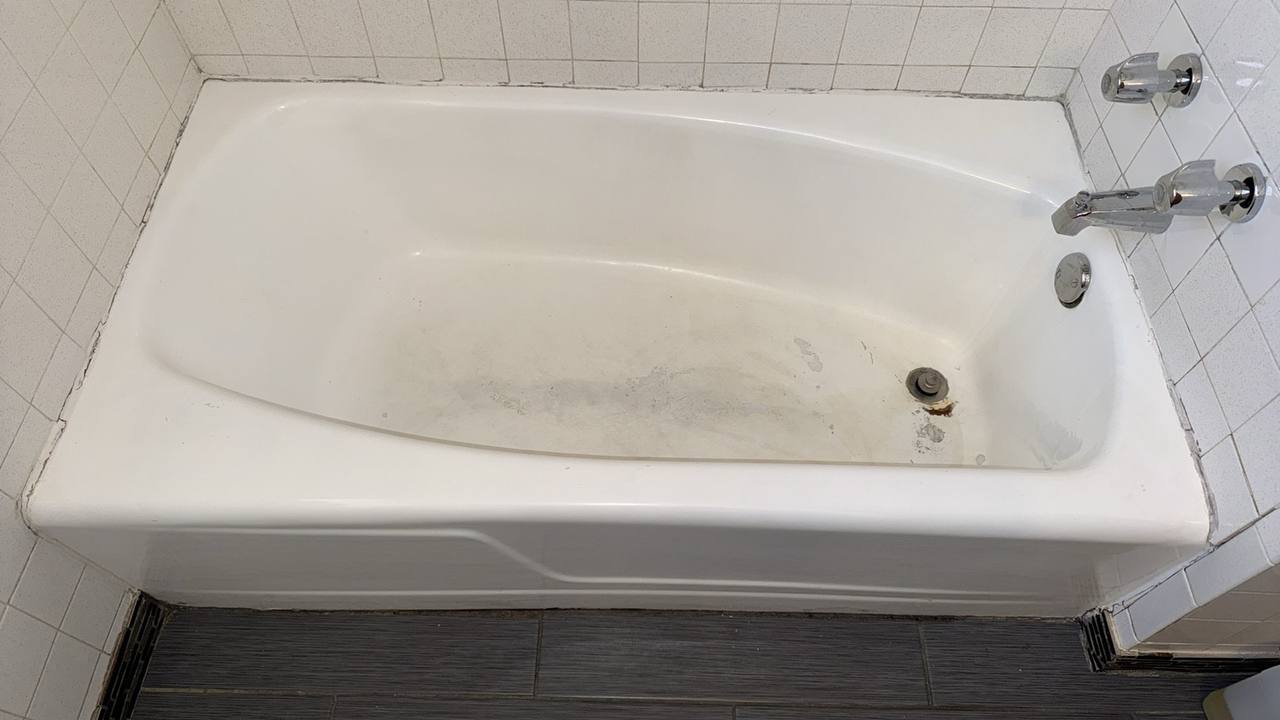 Before — worn bathtub