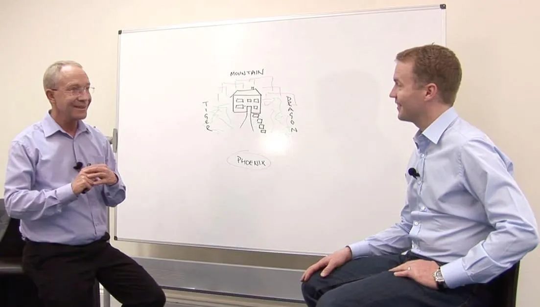 Jon Sandifer teaching Theo van Dort at the whiteboard