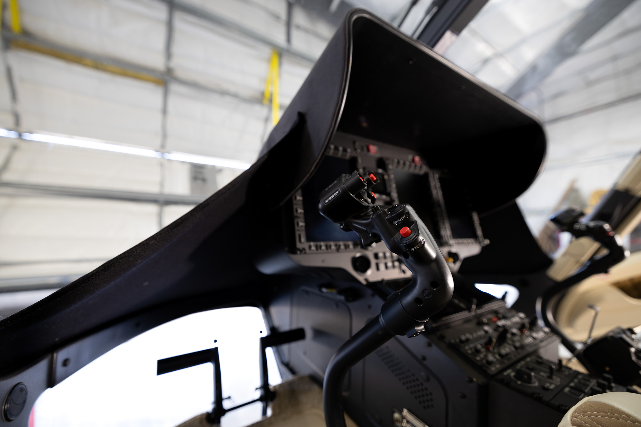 Cyclic stick close-up in the cockpit