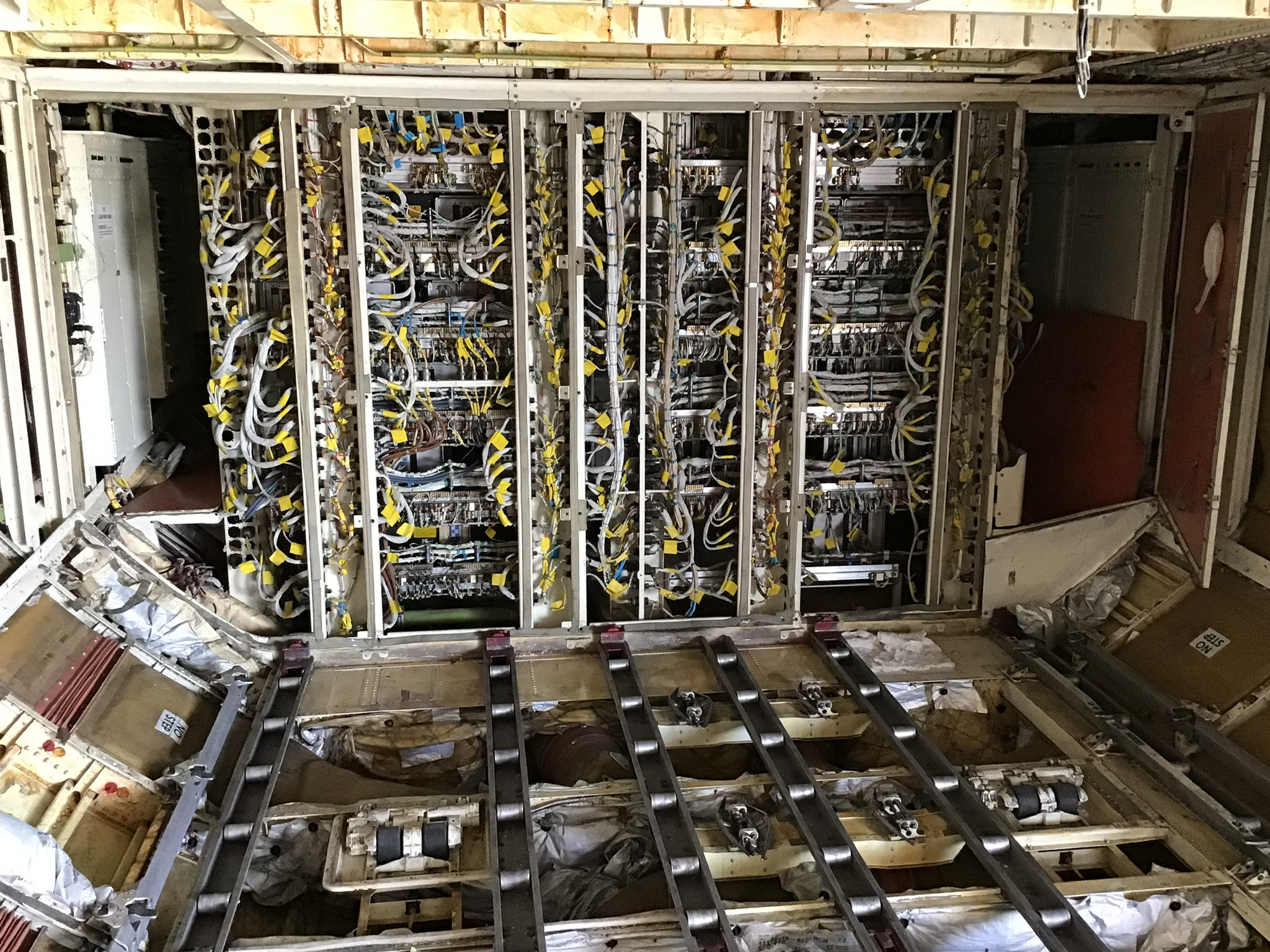Cabin panel removed exposing avionics wiring during reassembly