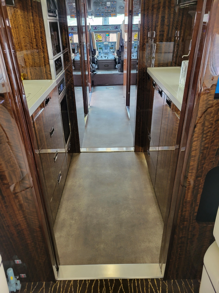 Finished G650 walkway to cockpit with walnut wood grain finishes