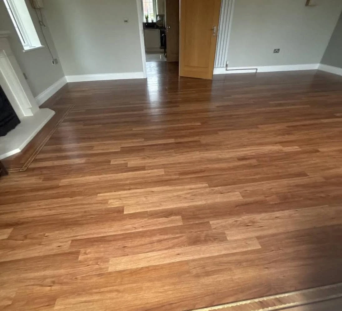 Worn wooden floor before restoration