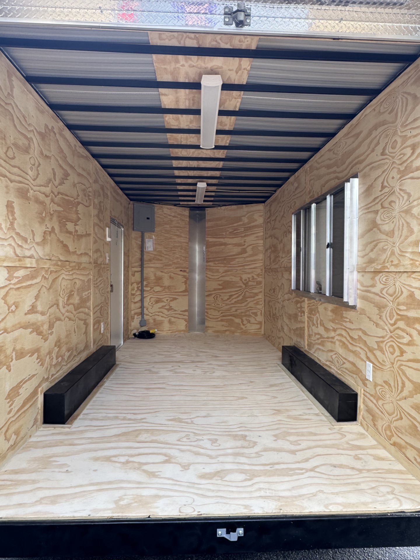 Interior flooring and wall finish in a Devil Dog Trailers build