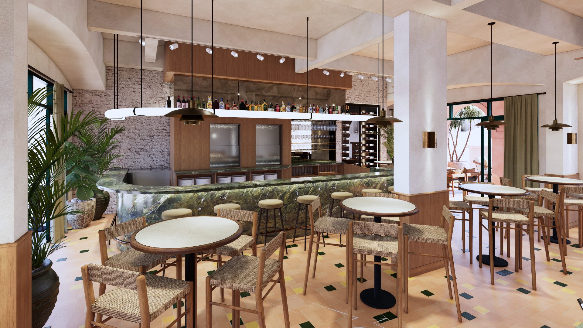 Ground floor dining and bar at Chill and Grill, with round tables, woven chairs and a green stone bar