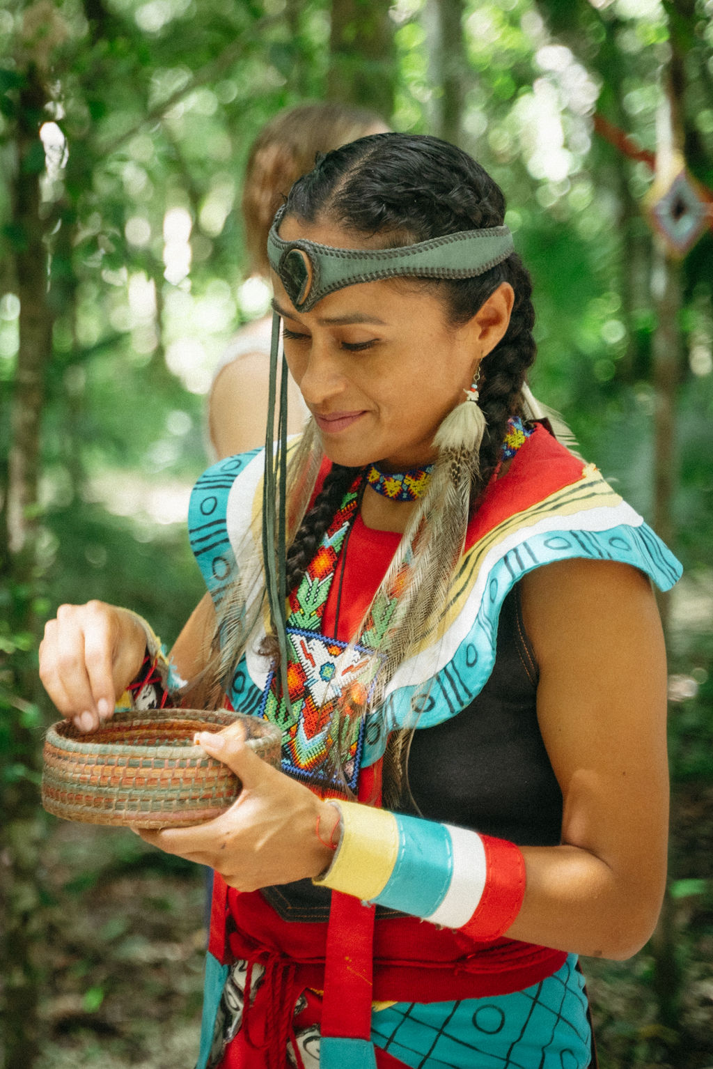 Ceremonial guide preparing sacred offerings