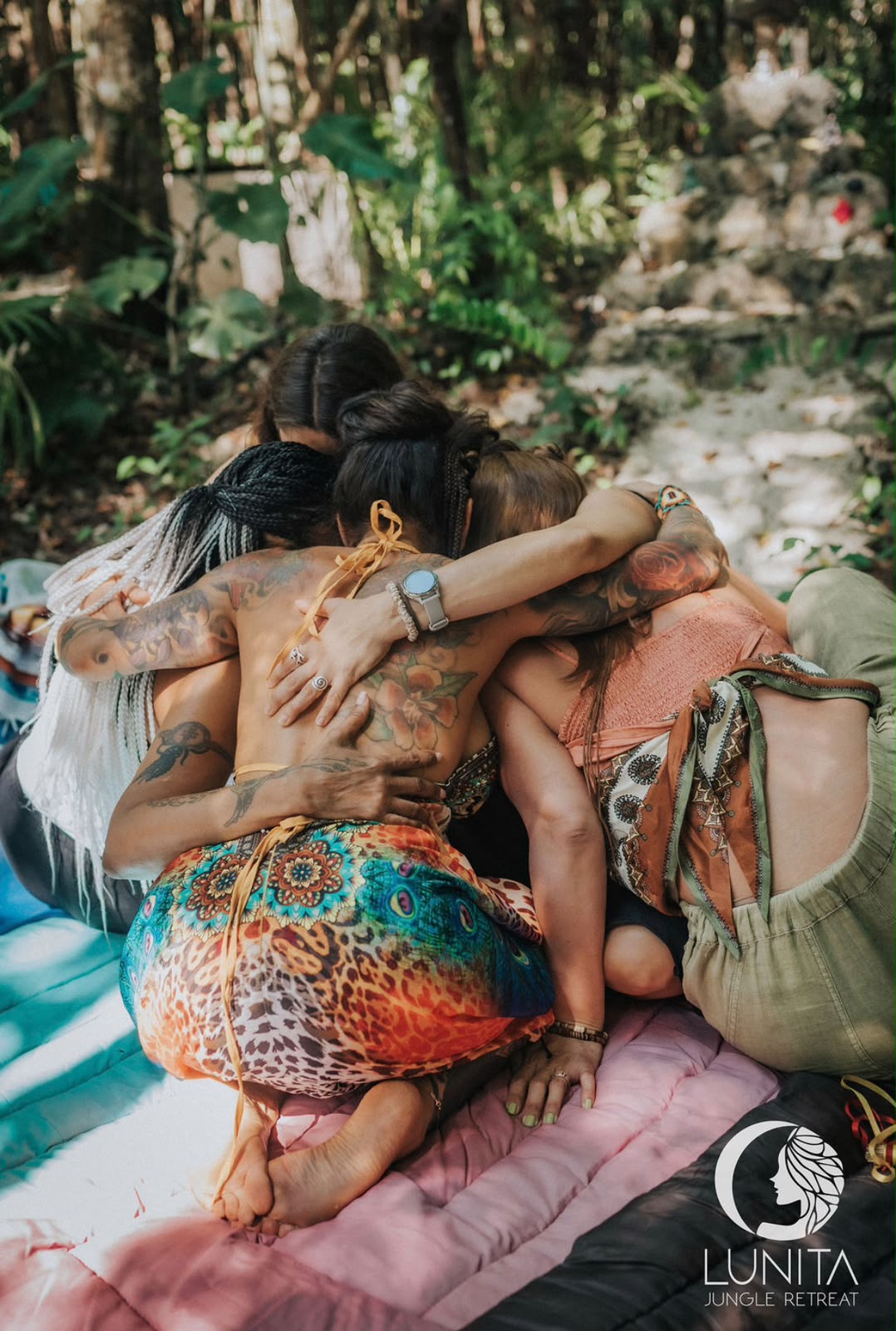 Group embrace during the closing ceremony at Lunita
