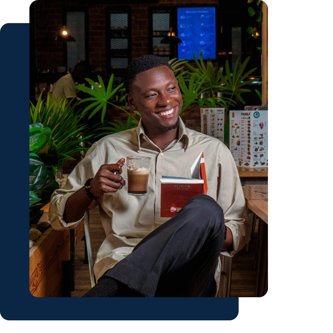 Professional smiling with a coffee, gaining clarity on personal and career goals