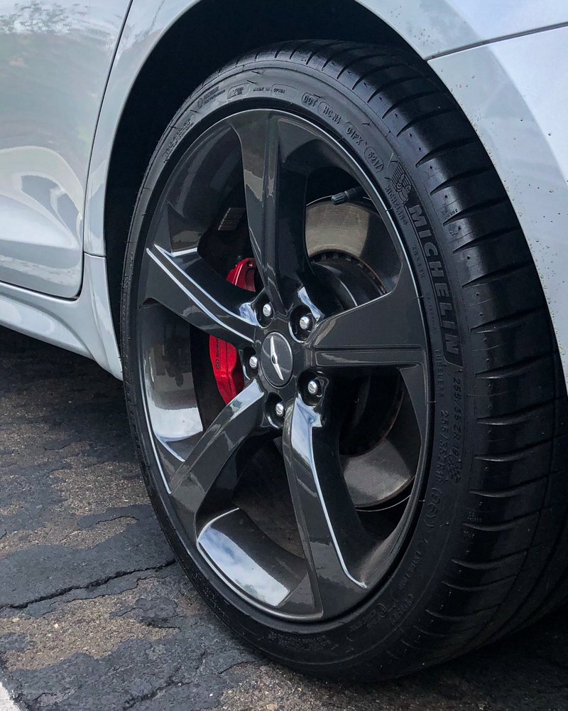 Cleaned wheel with tire dressing