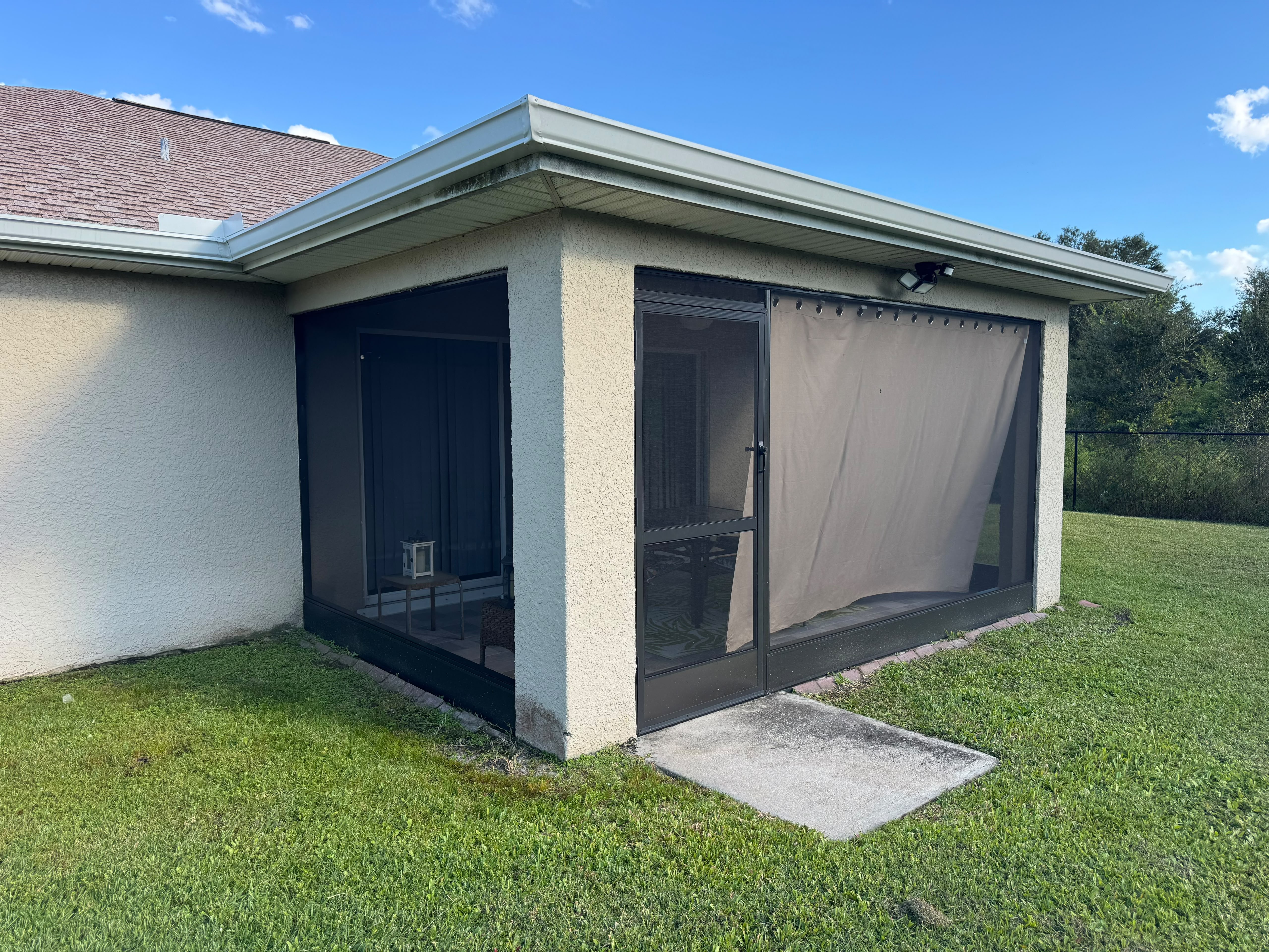 Completed screening around an existing covered outdoor space