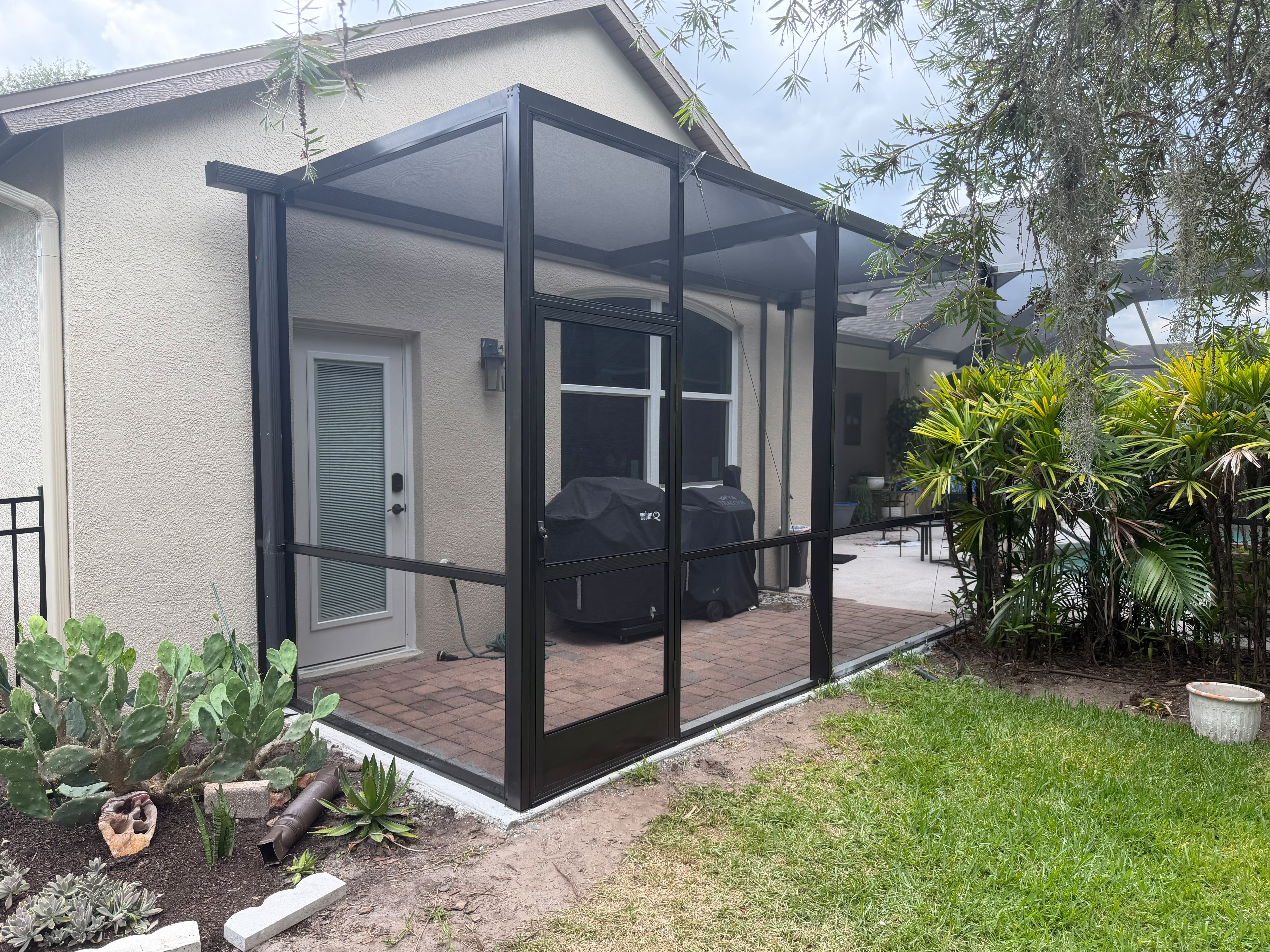 Completed dark framed screen installation at the second outdoor project