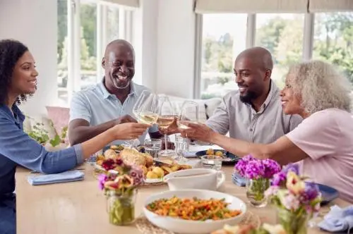 Adult children discussing reverse mortgage options with parents in California