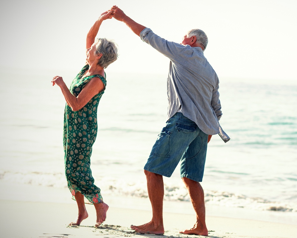 senior couple discussing the benefits of reverse mortgages