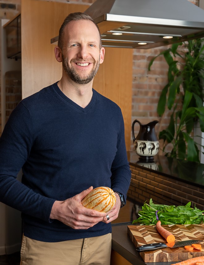 Ryan Syverson in the kitchen with fresh food