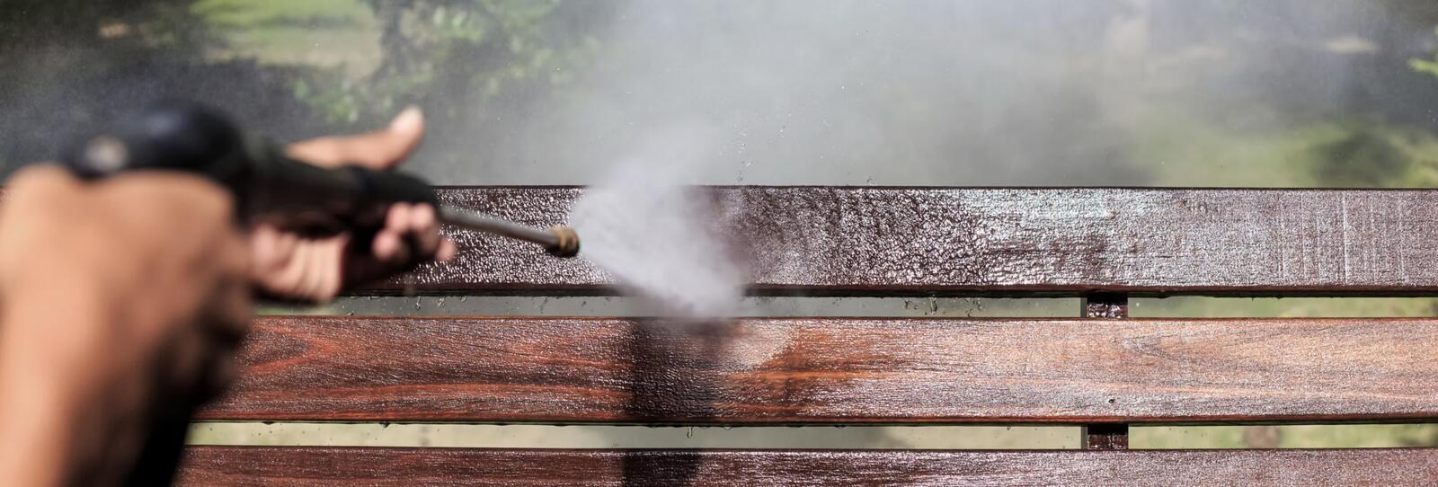 Southeast Cleaning Services pressure washing a wood deck