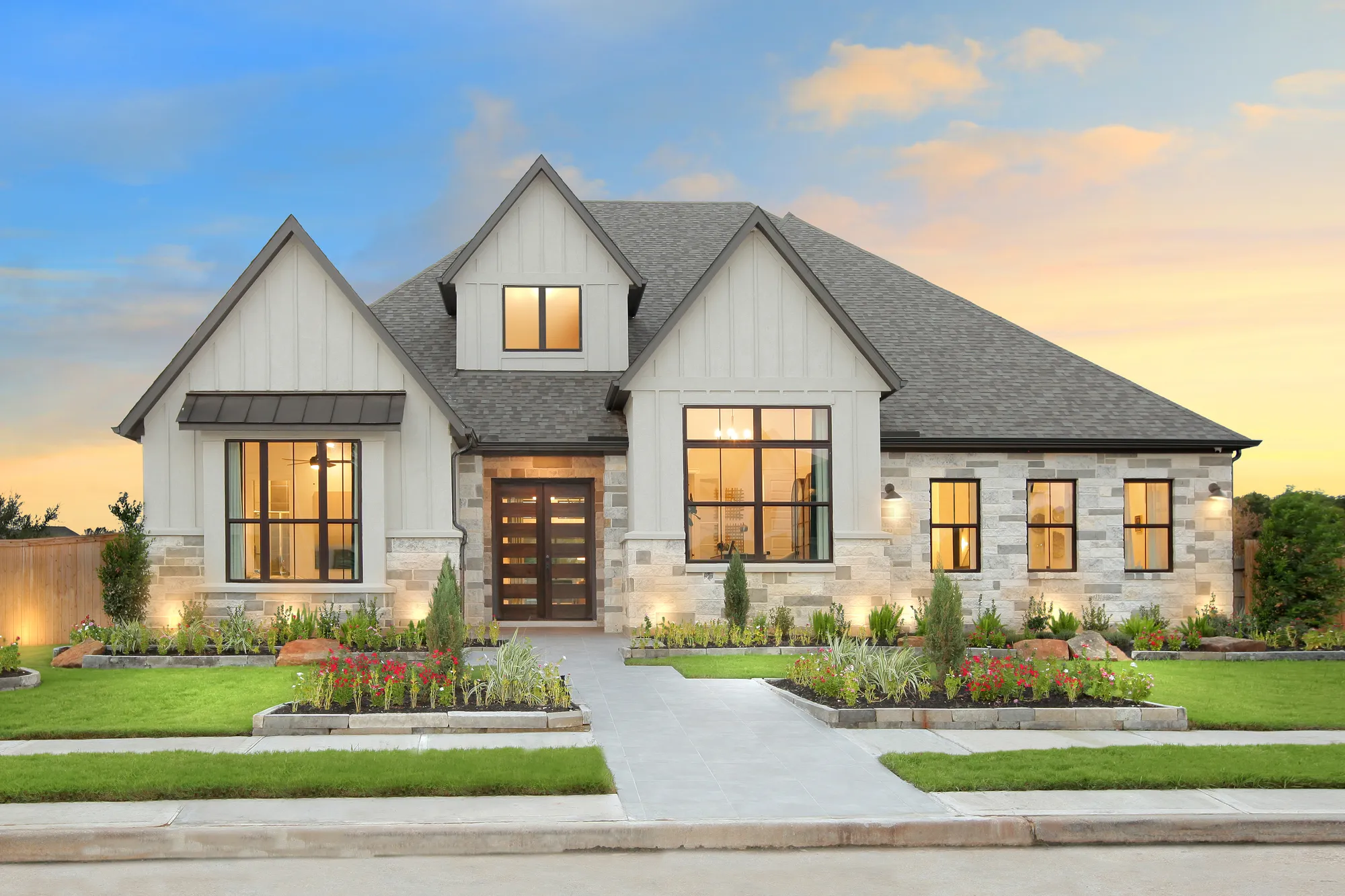 Newly constructed luxury home with modern architecture, landscaped front yard, and upscale residential curb appeal.