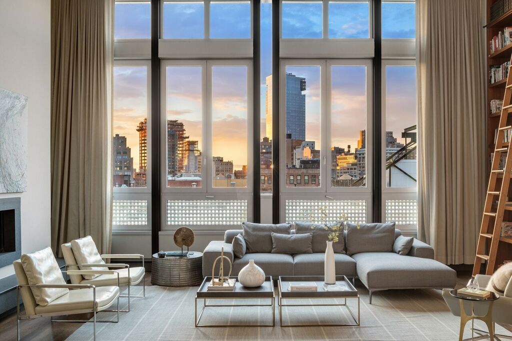 High-rise luxury living room with floor-to-ceiling windows, city skyline views, contemporary furnishings, and modern interior design.