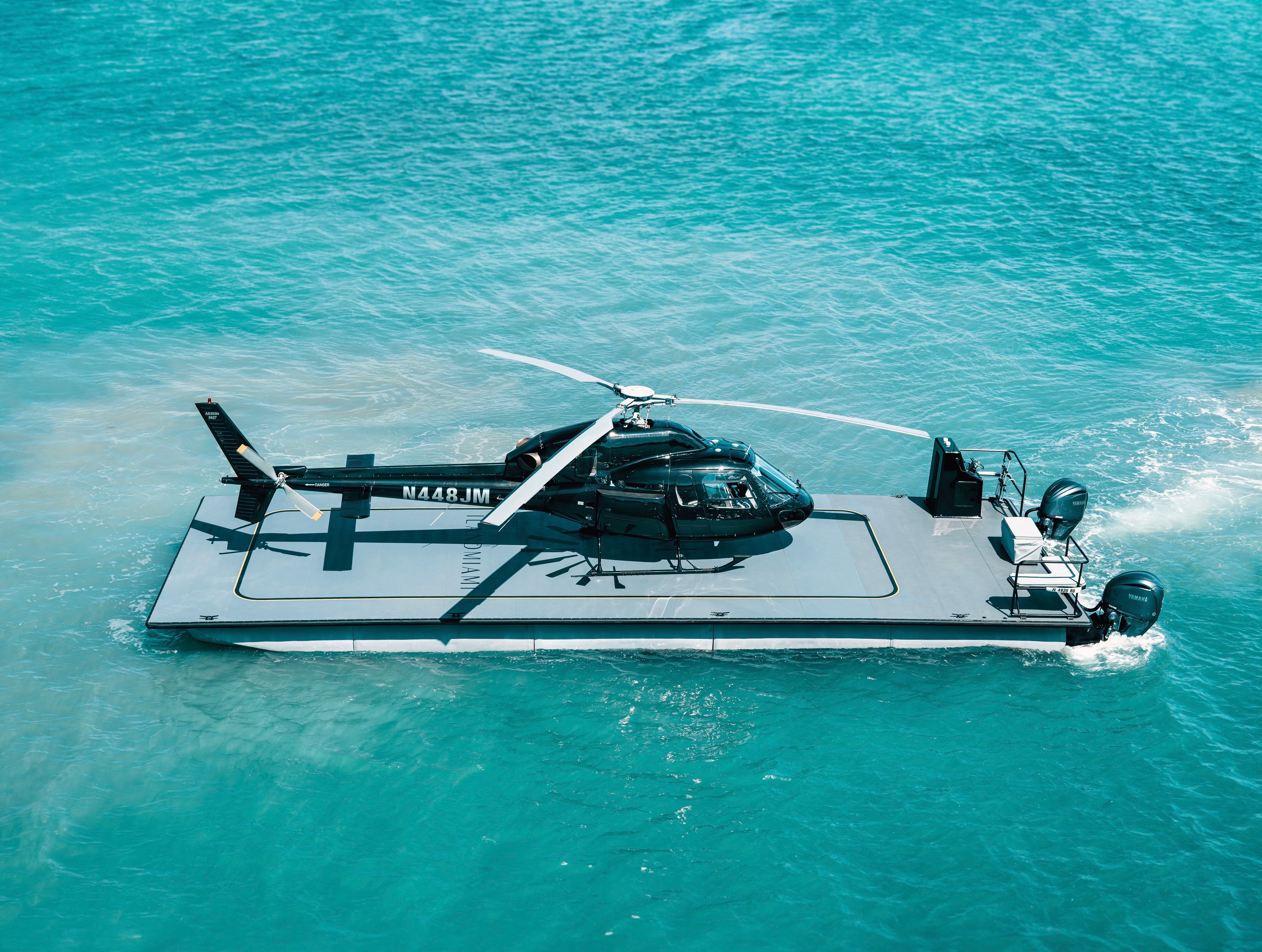 Helicopter positioned on an ILandMiami marine utility vessel featured by Robb Report