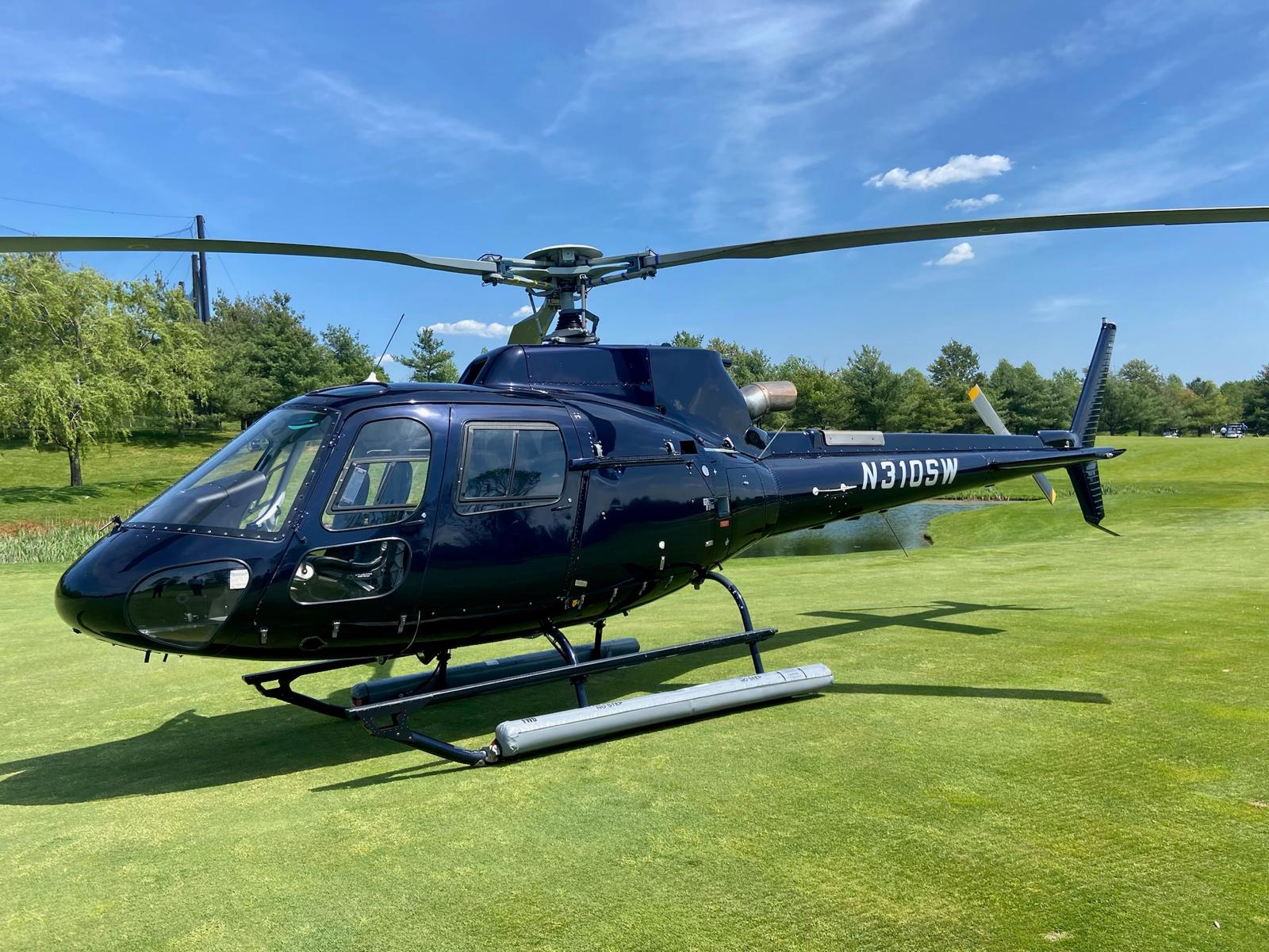 H125 helicopter displayed on a private lawn