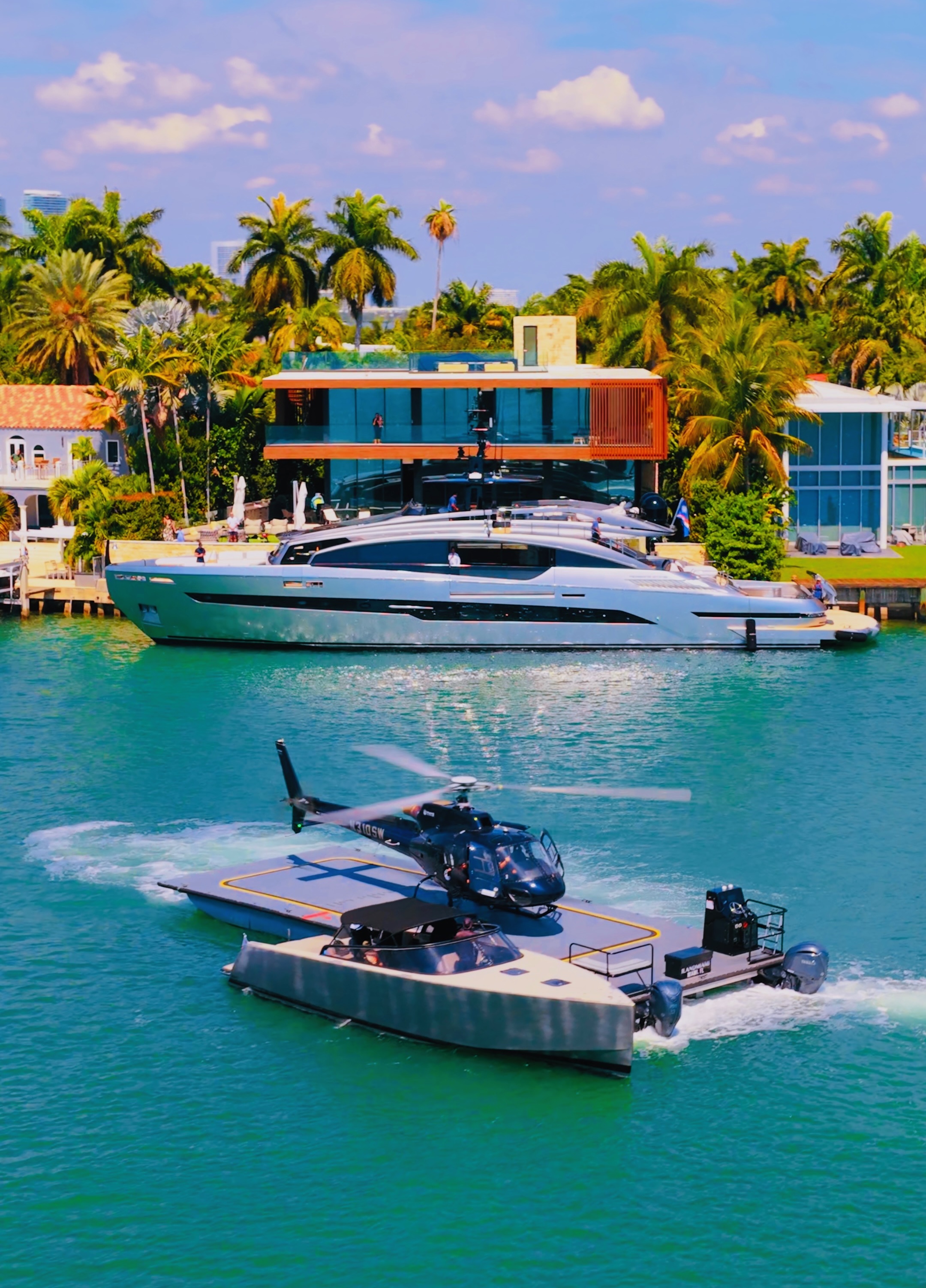 Helicopter arriving beside a luxury waterfront residence