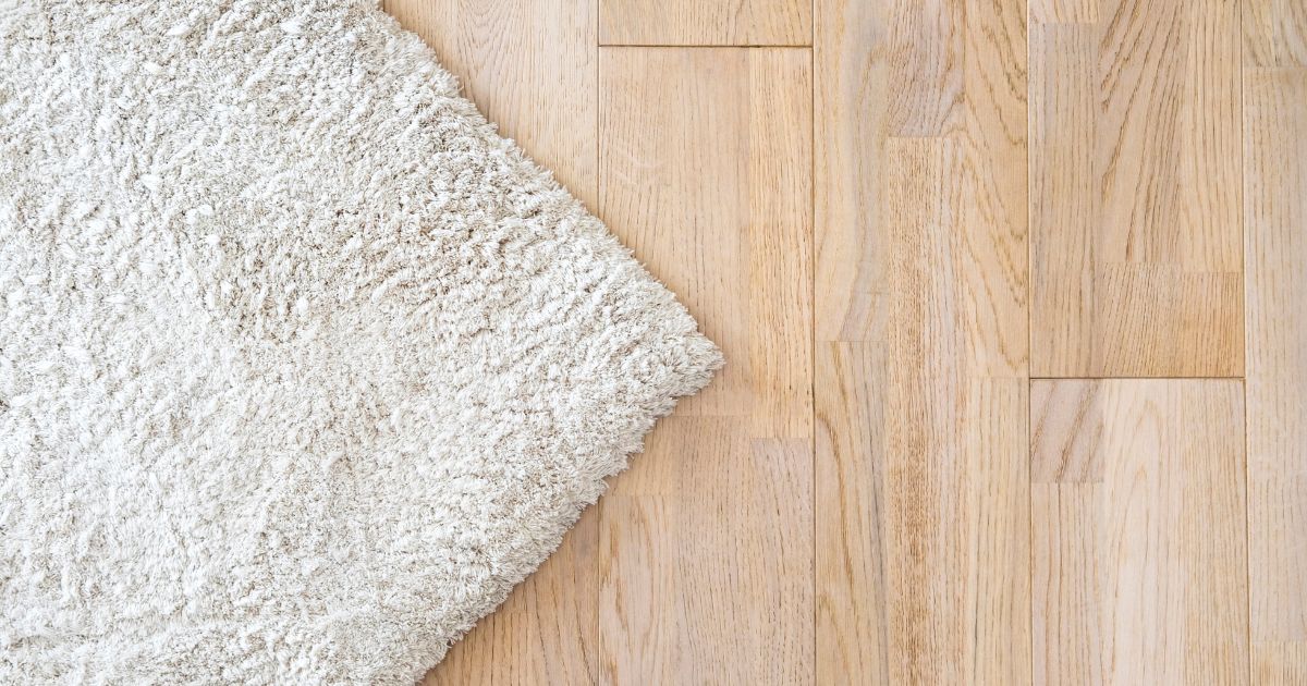white carpet over laminated flooring